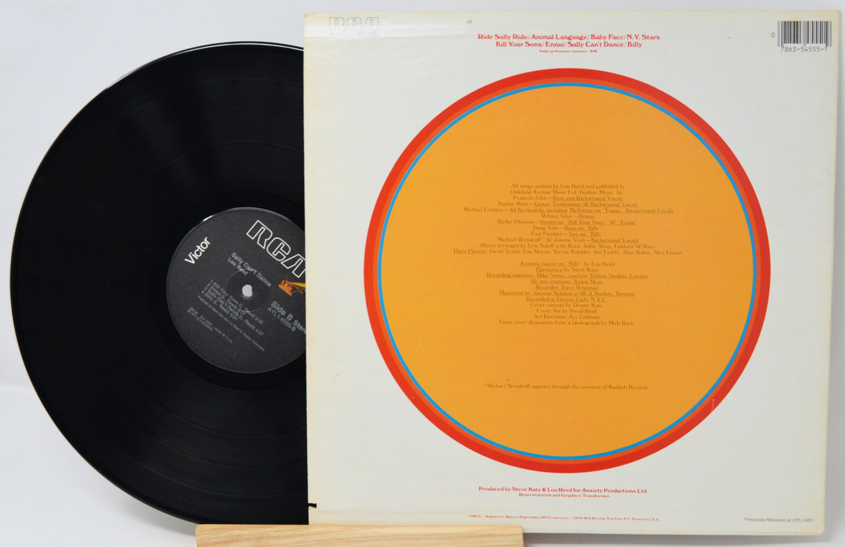 Vinyl record with orange label and white cover on a light gray background