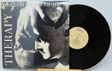 Vinyl record with cover featuring a black and white image of a person and the title 'Therapy' by Loudon Wainwright III.