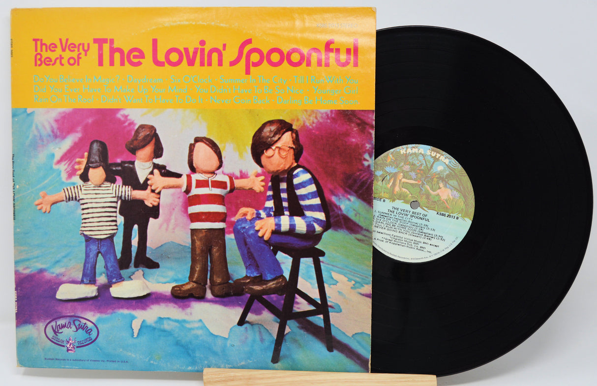 Vinyl record with cover featuring children and colorful text on a white background