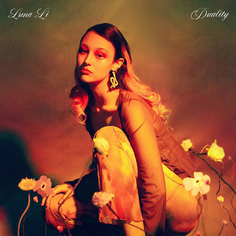 Luna Li posing in vibrant floral setting for 'Duality' album cover