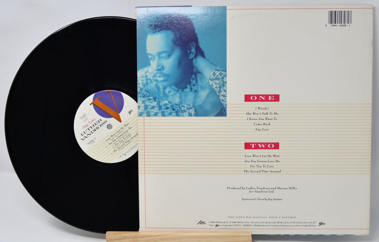 Vinyl record with cover featuring a person's face and text
