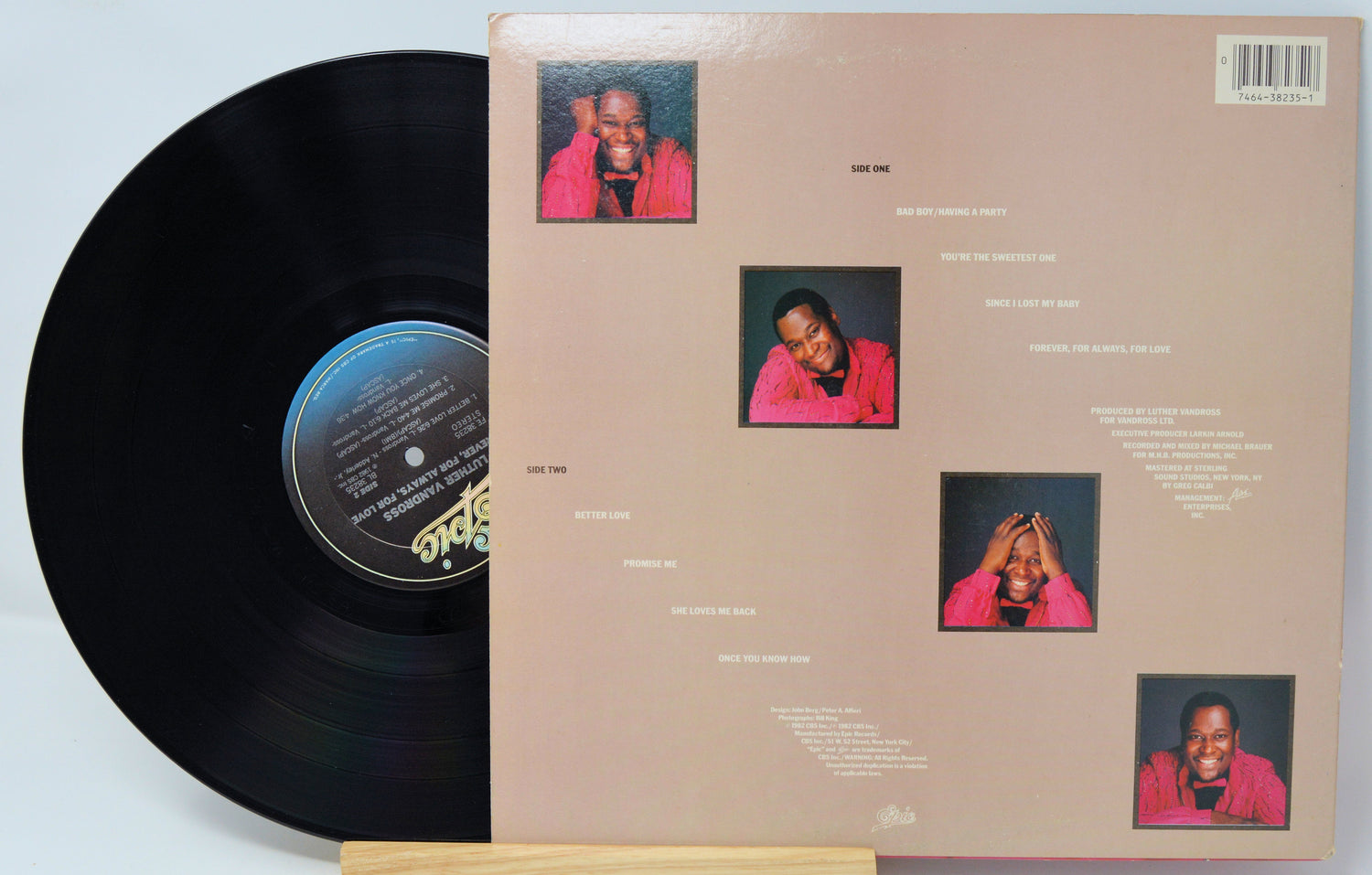 Vinyl record with a cover featuring multiple small images of a person in a pink outfit.