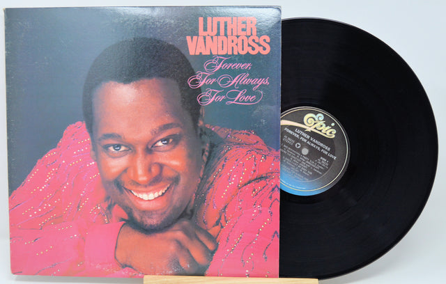Vinyl record with cover featuring a smiling man, labeled 'Luther Vandross Forever Your Always Far Love'.
