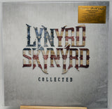 Lynyrd Skynyrd 'Collected' 12-inch vinyl record sleeve inside a clear protective case, featuring a textured gray cover with the band's name in distressed metallic lettering and a gold limited edition sticker in the top right corner.