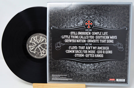 Back cover and vinyl record of Lynyrd Skynyrd God & Guns showing album tracklist