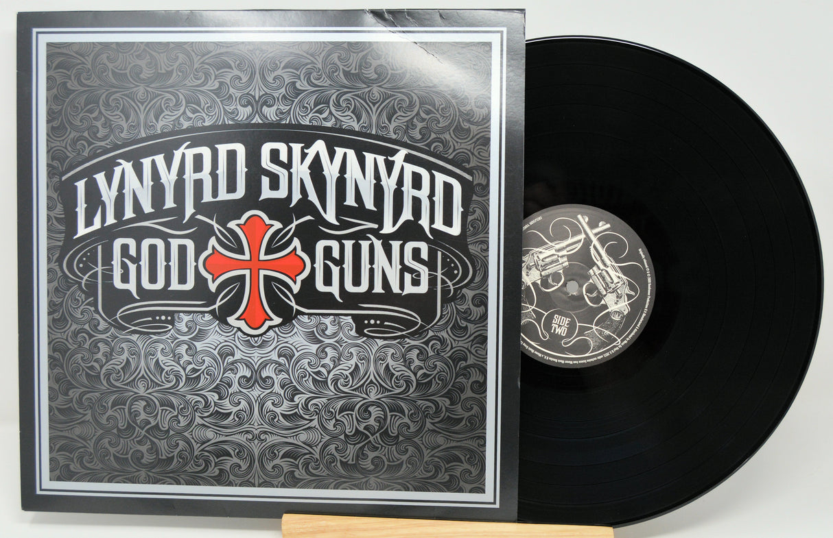 Front cover of Lynyrd Skynyrd God & Guns vinyl album with bold logo design