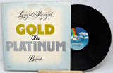 Vinyl record and cover with 'Gold & Platinum' text on a white background