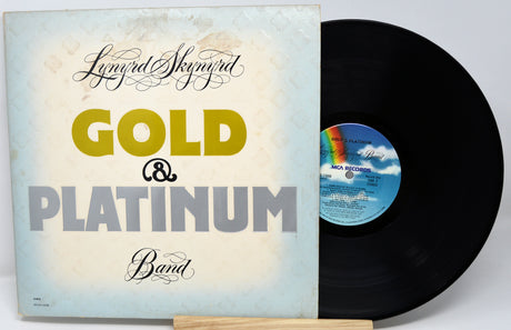 Vinyl record and cover with 'Gold & Platinum' text on a white background