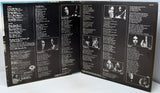 Back cover of a vinyl record with text and black and white images.