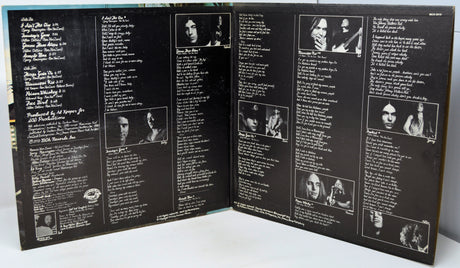 Back cover of a vinyl record with text and black and white images.