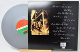 Back cover and silver vinyl LP of Lynyrd Skynyrd's The Last Rebel album, tracklist visible