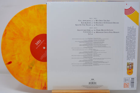 Vinyl record with a colorful label and text on a white background