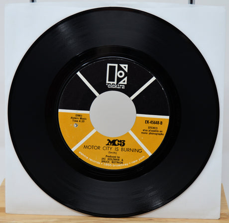 45 RPM record with 'Motor City is Burning' on a white background