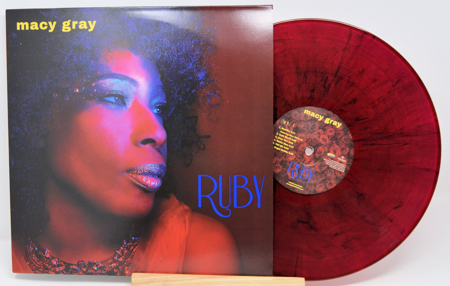 Front cover of Macy Gray's Ruby album with artist portrait and red marbled vinyl record