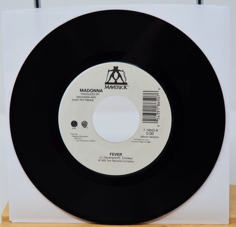 Vinyl record with a white label featuring 'Maverick' and 'Madonna' on a white background.