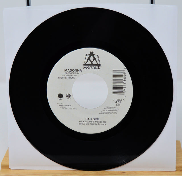 Vinyl record with a white label featuring 'Maverick' and 'Warner Bros.' logos on a white background.