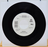 Vinyl record with label featuring 'Madonna' on a white background
