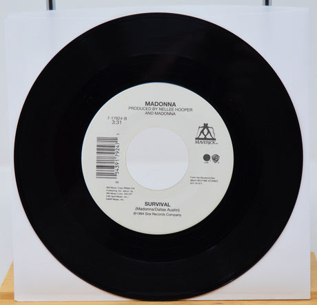 Vinyl record with label featuring 'Madonna' on a white background