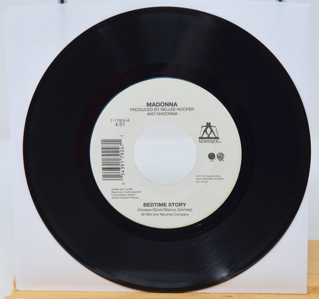 Vinyl record with label on a white background