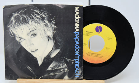 A used 7-inch vinyl record of Madonna's 'Papa Don't Preach' with the cover displayed alongside.