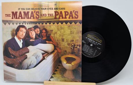 Vinyl record album 'The Mama's and the Papa's' by Brunswick, shown with the printed cover on the left and the black LP record partially visible on the right against a light gray background.