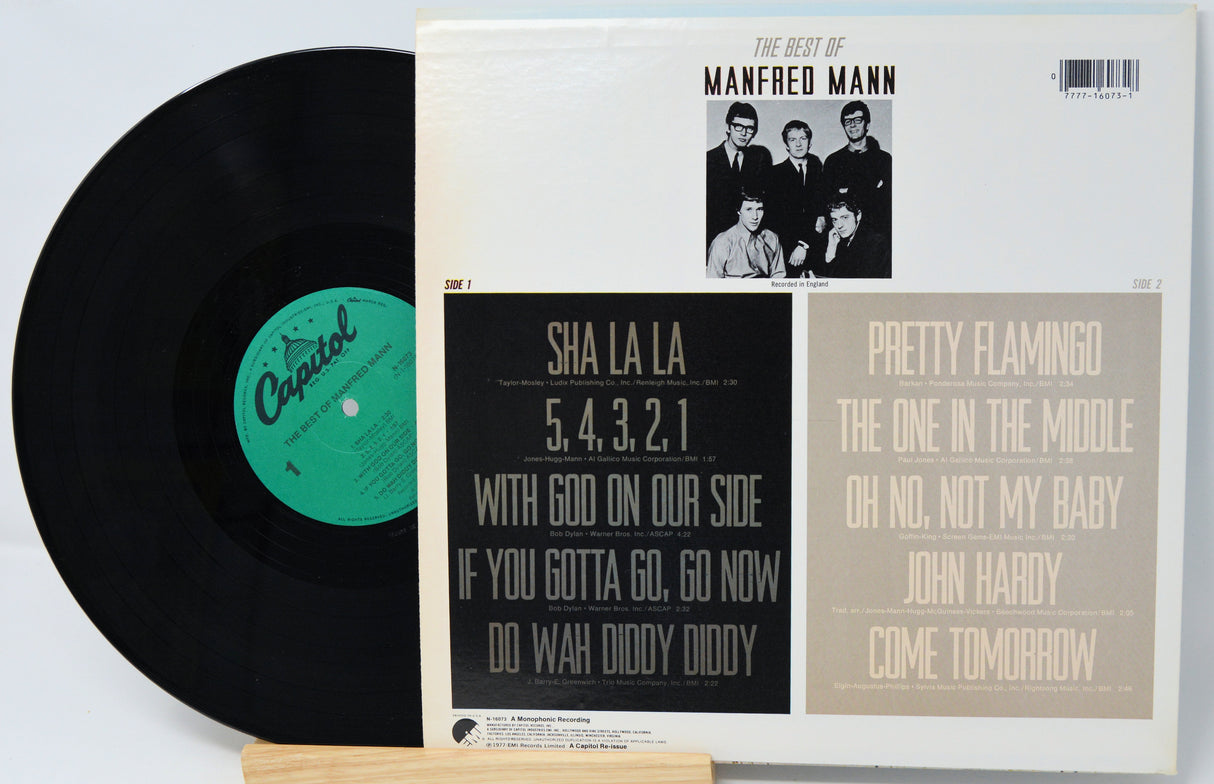 Vinyl record and cover of 'The Best of Manfred Mann' on a light gray background