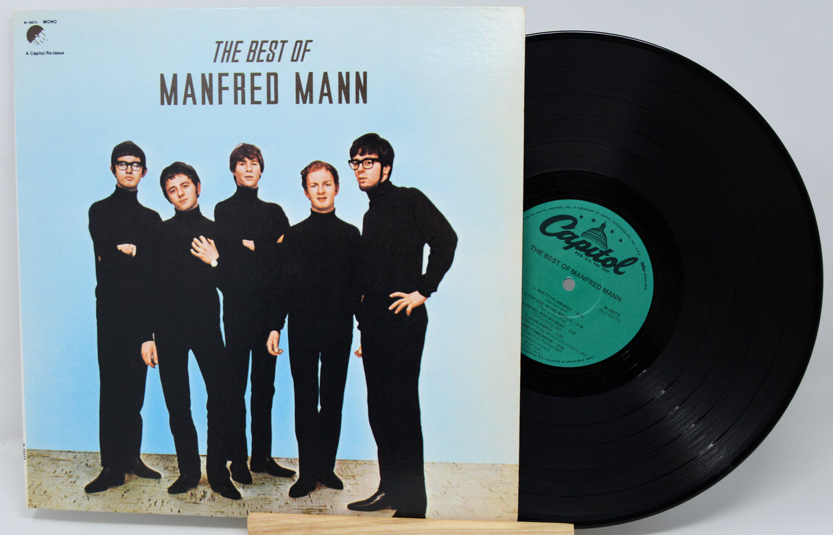 Vinyl record and cover for 'The Best of Manfred Mann' with a blue background and band members on the cover.