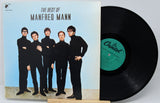 Vinyl record and cover for 'The Best of Manfred Mann' with a blue background and band members on the cover.