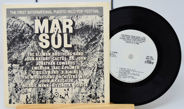 Back cover and record of Mar Y Sol Puerto Rico Pop Festival Atco Sampler vinyl EP highlighting festival artists in monochrome art.