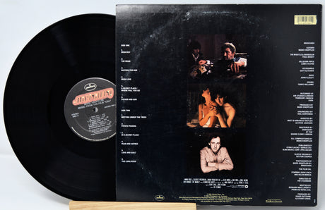Vinyl record with a black cover featuring images and text on a white background