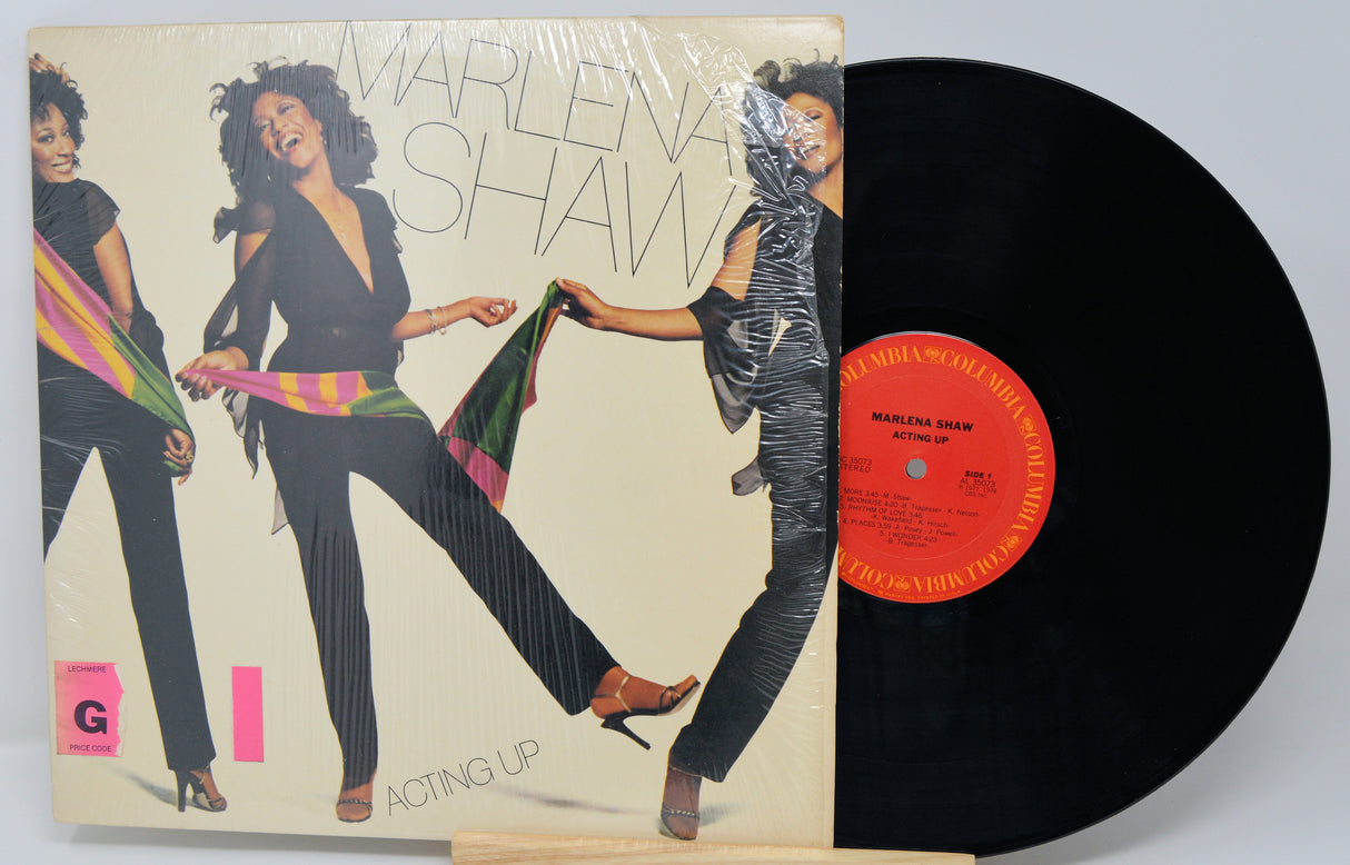 Vinyl record with cover featuring a dancer and text 'Marlena Shaw Acting Up'.