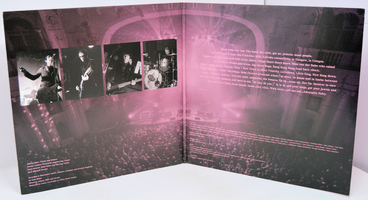 Album cover with black and white photos of a band on the left and text on the right, with a pink overlay.