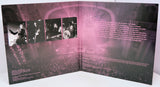Album cover with black and white photos of a band on the left and text on the right, with a pink overlay.