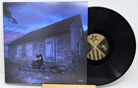 Eminem Marshall Mathers LP 2 album cover with vinyl record, Eminem in front of boarded Detroit house
