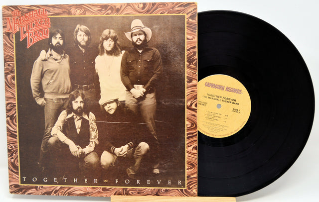 Vinyl record with cover featuring a group of people and text 'Together Forever'.