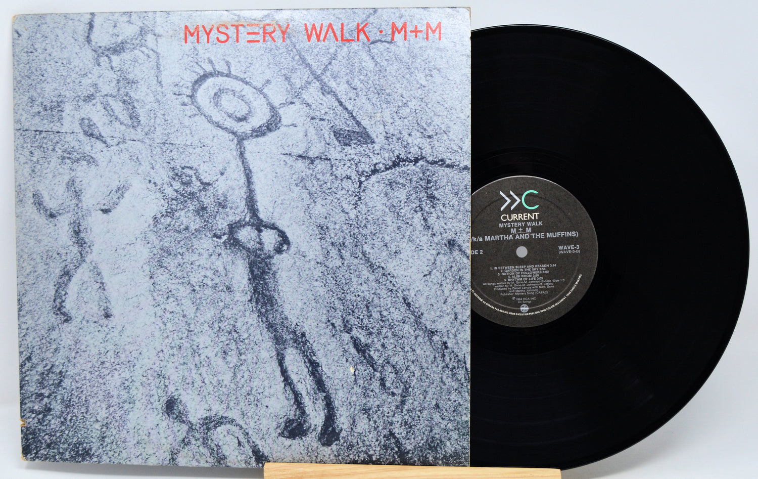Vinyl record with a cover featuring abstract art and text 'Mystery Walk M+M'.