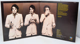 Album cover with a person smoking a cigarette, featuring text on a dark background.