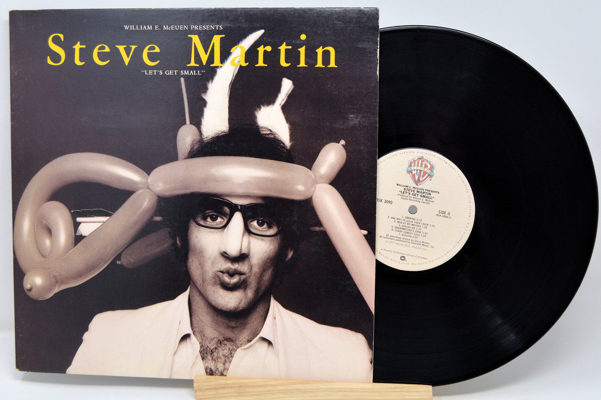 Vinyl record with a cover featuring Steve Martin and balloon hats on a white background