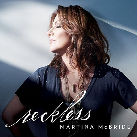 Album cover for 'Reckless' by Martina McBride featuring a woman against a light background.
