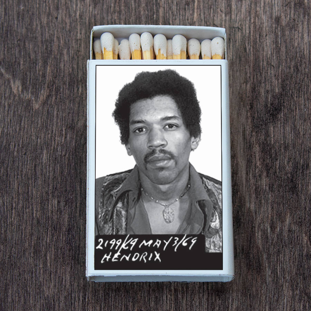 Open matchbox with iconic black and white photo of a famous musician on the cover.