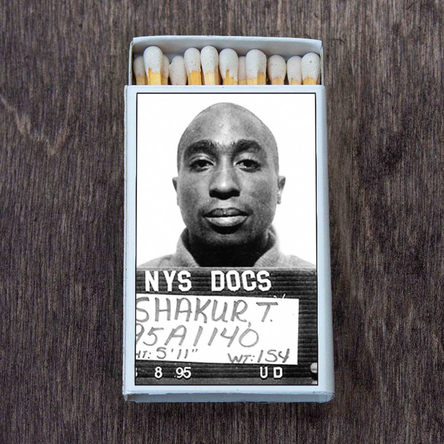Box of matches with iconic black and white mugshot photo on the cover