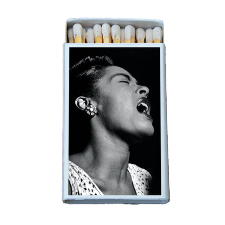 Collectible matchbox featuring a black-and-white photo of a jazz singer passionately singing