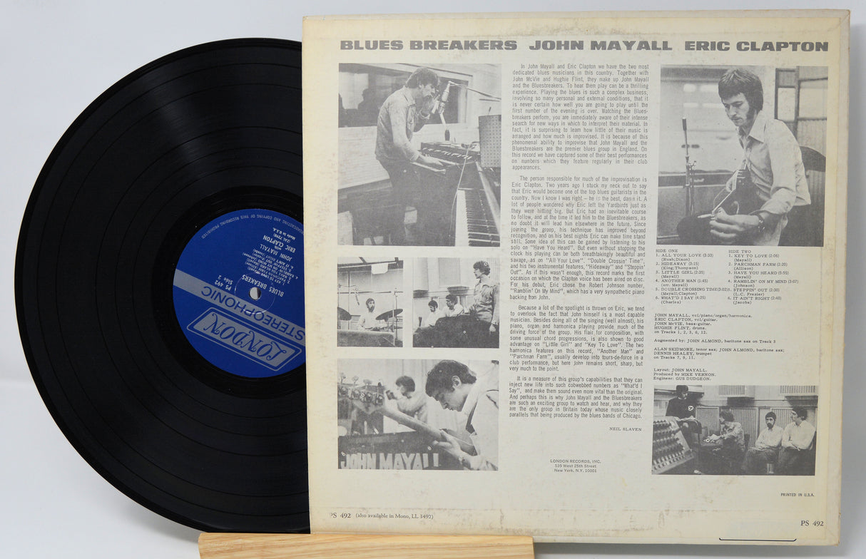 Vinyl record with a gatefold cover featuring black and white photos and text of musicians.