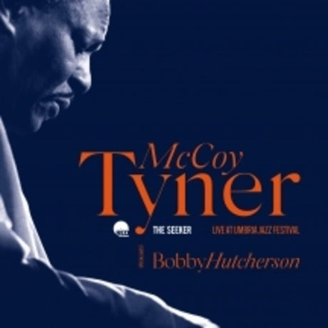 Album cover featuring McCoy Tyner with a blue background and orange text.