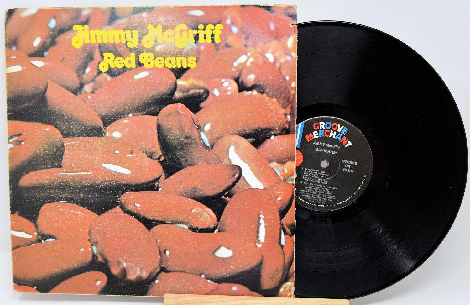 Vinyl record with cover featuring red beans and 'Jimmy McGriff Red Beans' text.