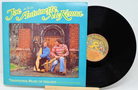 Vinyl record with cover featuring two people playing harp and bodhrán, titled 'Traditional Music of Ireland'.