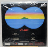 Cargo band 'Life of the Party' vinyl record cover, shrink-wrapped in plastic, featuring a blue butterfly-shaped landscape with a sunset gradient and a small green island on a black background.