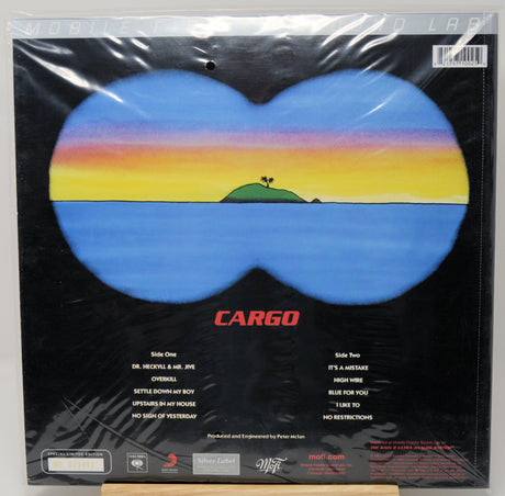 Cargo band 'Life of the Party' vinyl record cover, shrink-wrapped in plastic, featuring a blue butterfly-shaped landscape with a sunset gradient and a small green island on a black background.