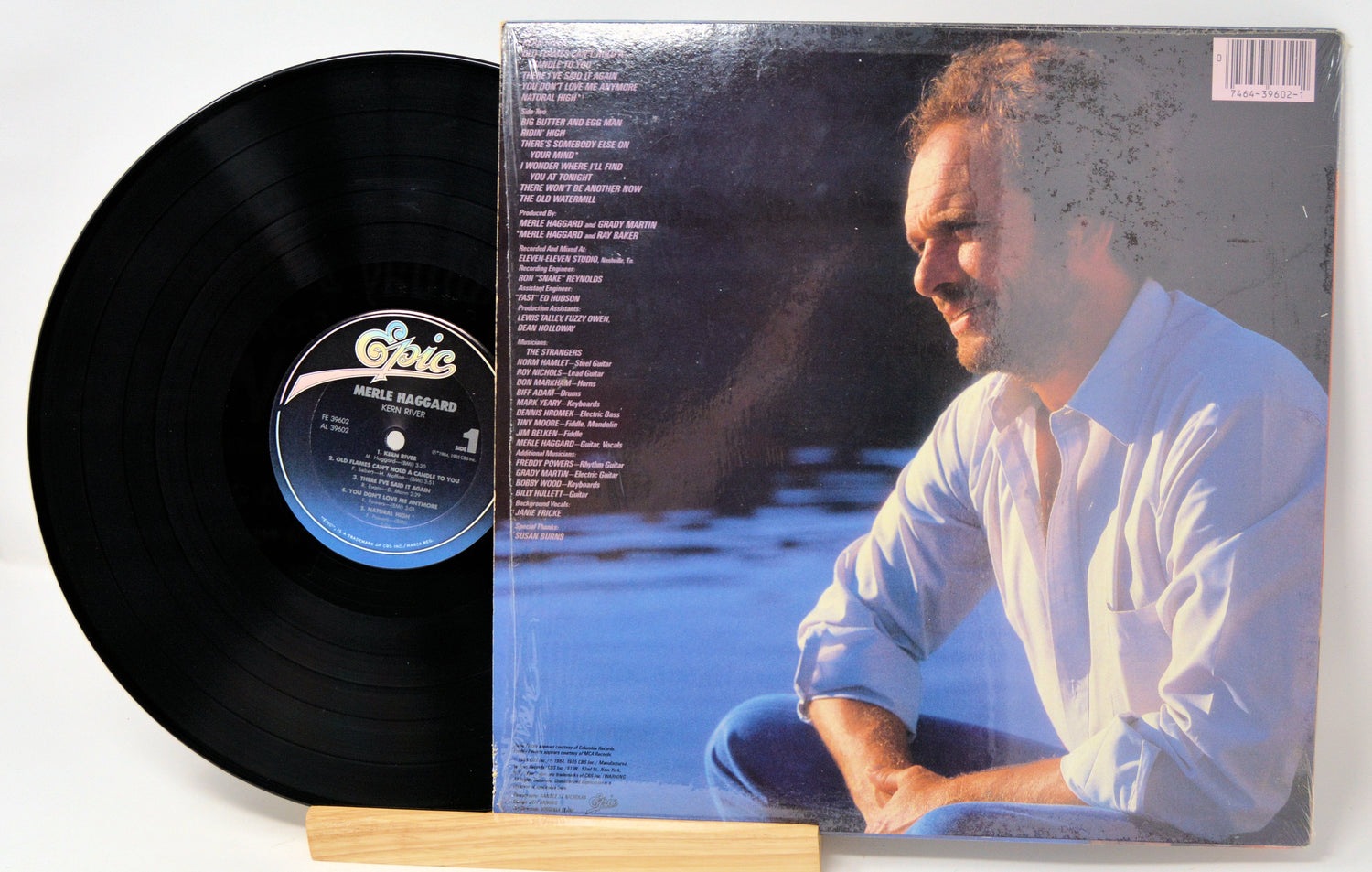 Back cover and vinyl record of Merle Haggard's Kern River LP showing song list and artist portrait