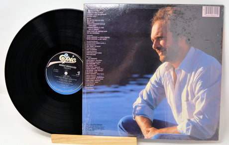 Back cover and vinyl record of Merle Haggard's Kern River LP showing song list and artist portrait
